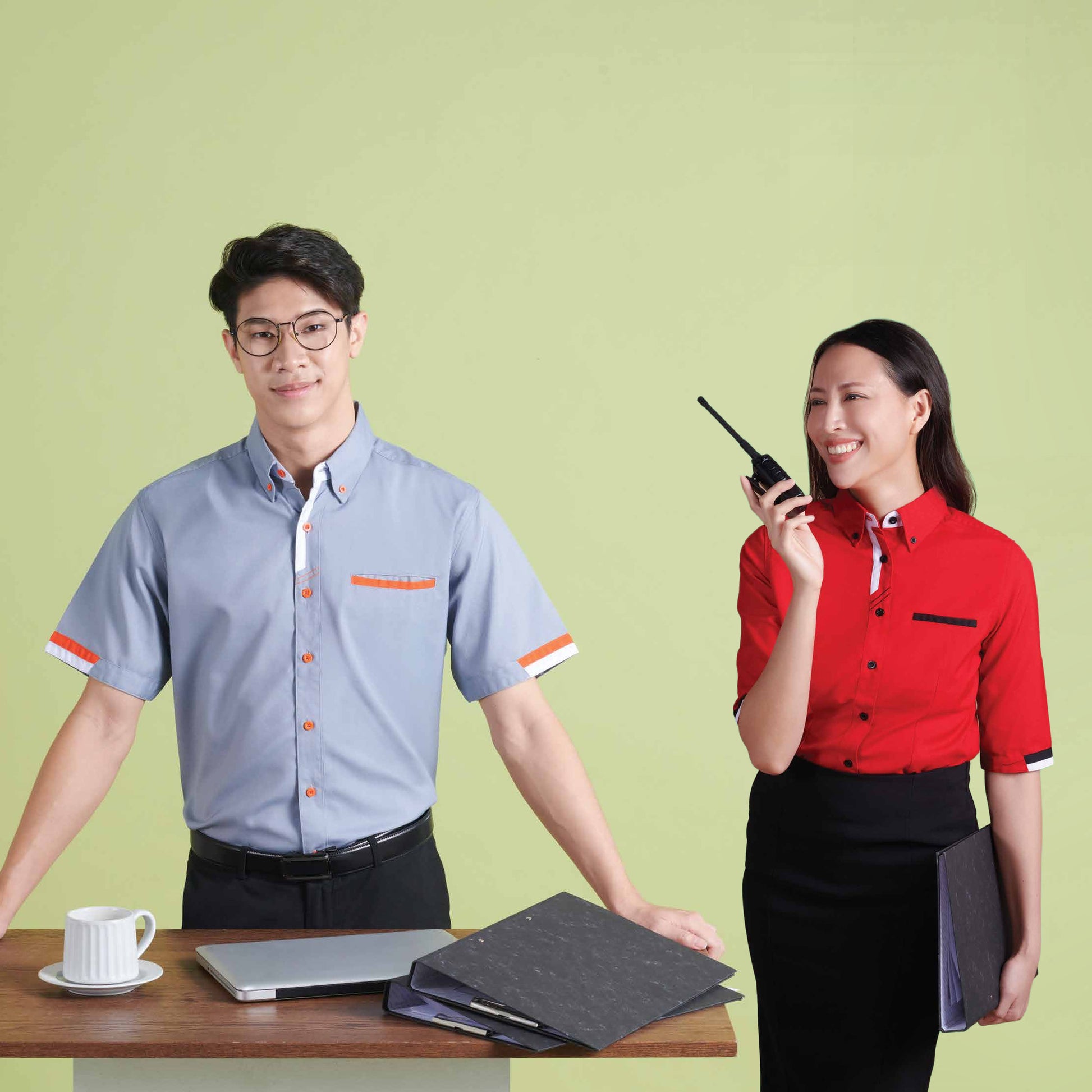 Office staff wearing F1 2624 unisex short sleeve and F1 2705 female 3/4 sleeve corporate uniform shirts