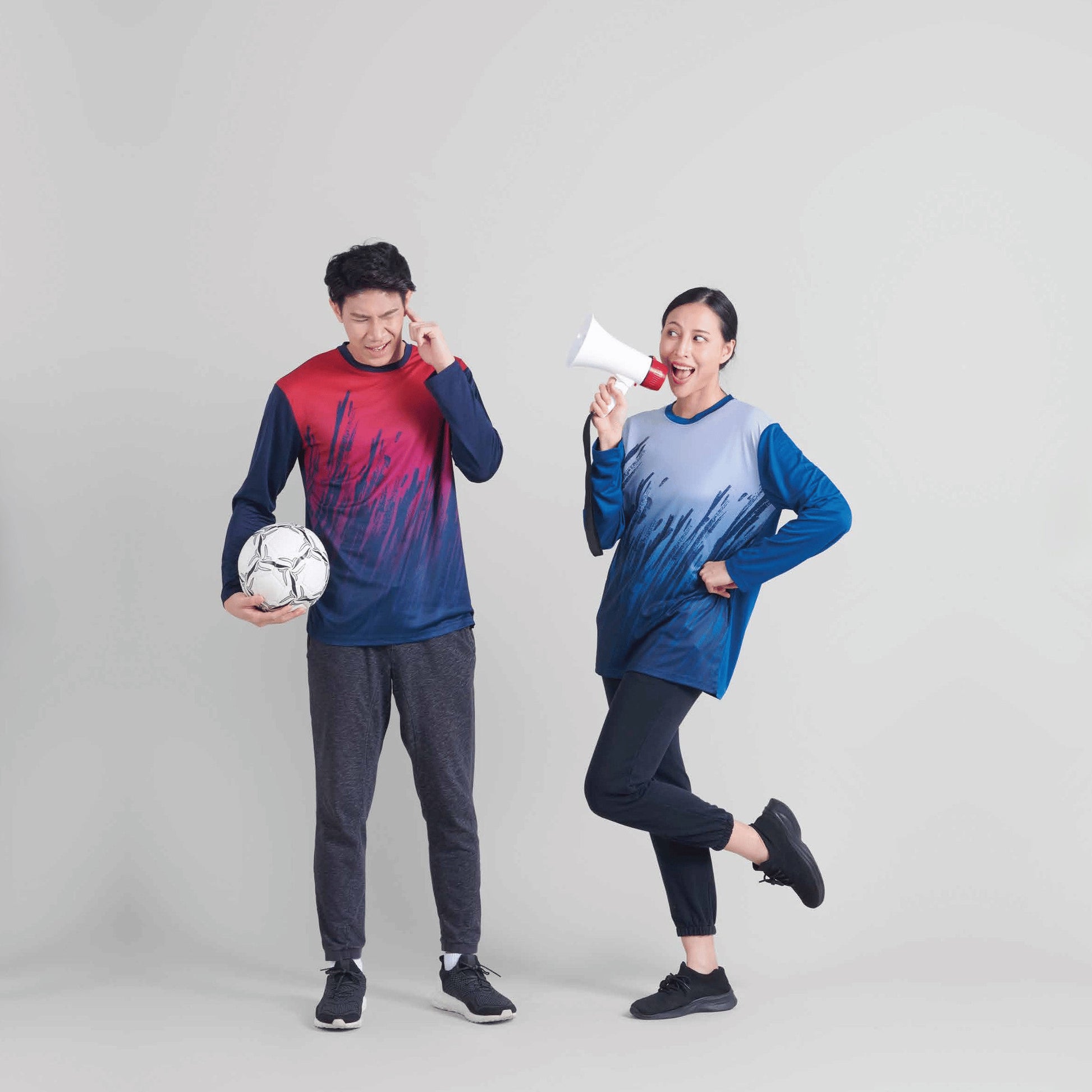 Model wearing the QD83 unisex sublimation mini eyelet long sleeve t-shirt, showing the all-over printed design