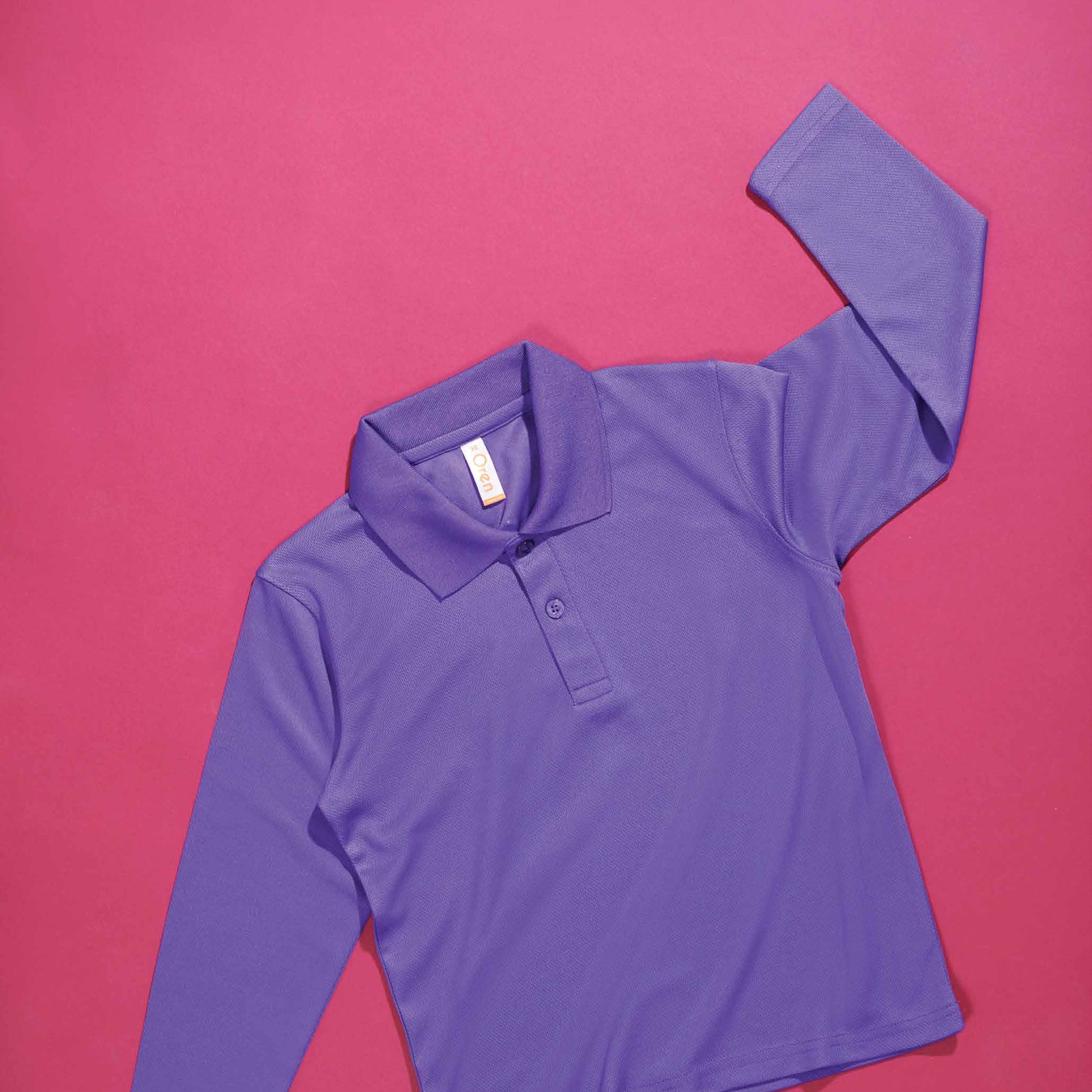 QD99 kids microfibre eyelet long sleeve polo shirt flat lay in bright colours